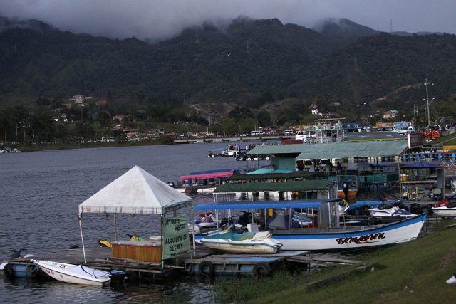 Boats are docked at the reservoir where a ferry sank in Guatape (Luis Benavides/AP)