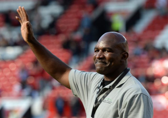 Evander Holyfield waves