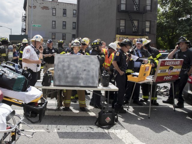 Rescue teams at the scene (Mary Altaffer/AP)