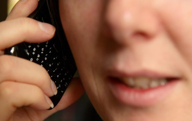Close-up view of a woman talking on a mobile phone