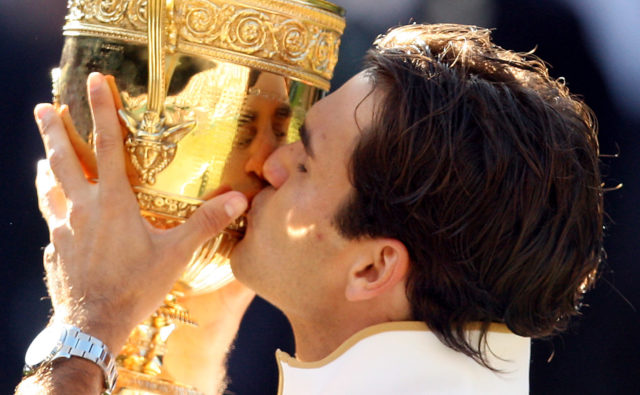 Roger Federer celebrates winning Wimbledon