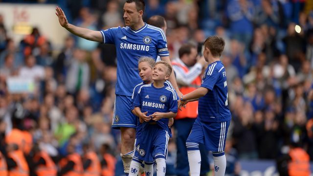 John Terry on a lap of honour with his kids at the end of Chelsea's season in May 2014