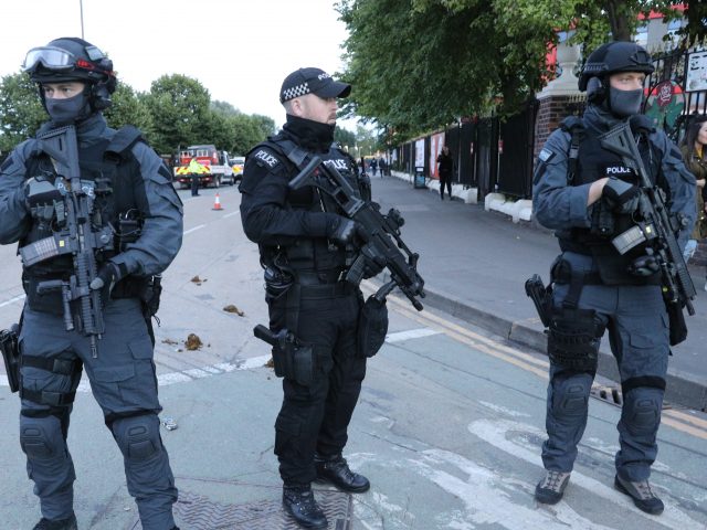 Armed police on patrol during last month's One Love Manchester concert (Owen Humphreys/PA)