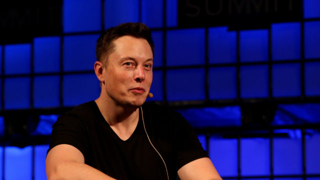 Musk said he is working round the clock to help get through the backlog of cars Tesla has to produce (Brian Lawless/PA)