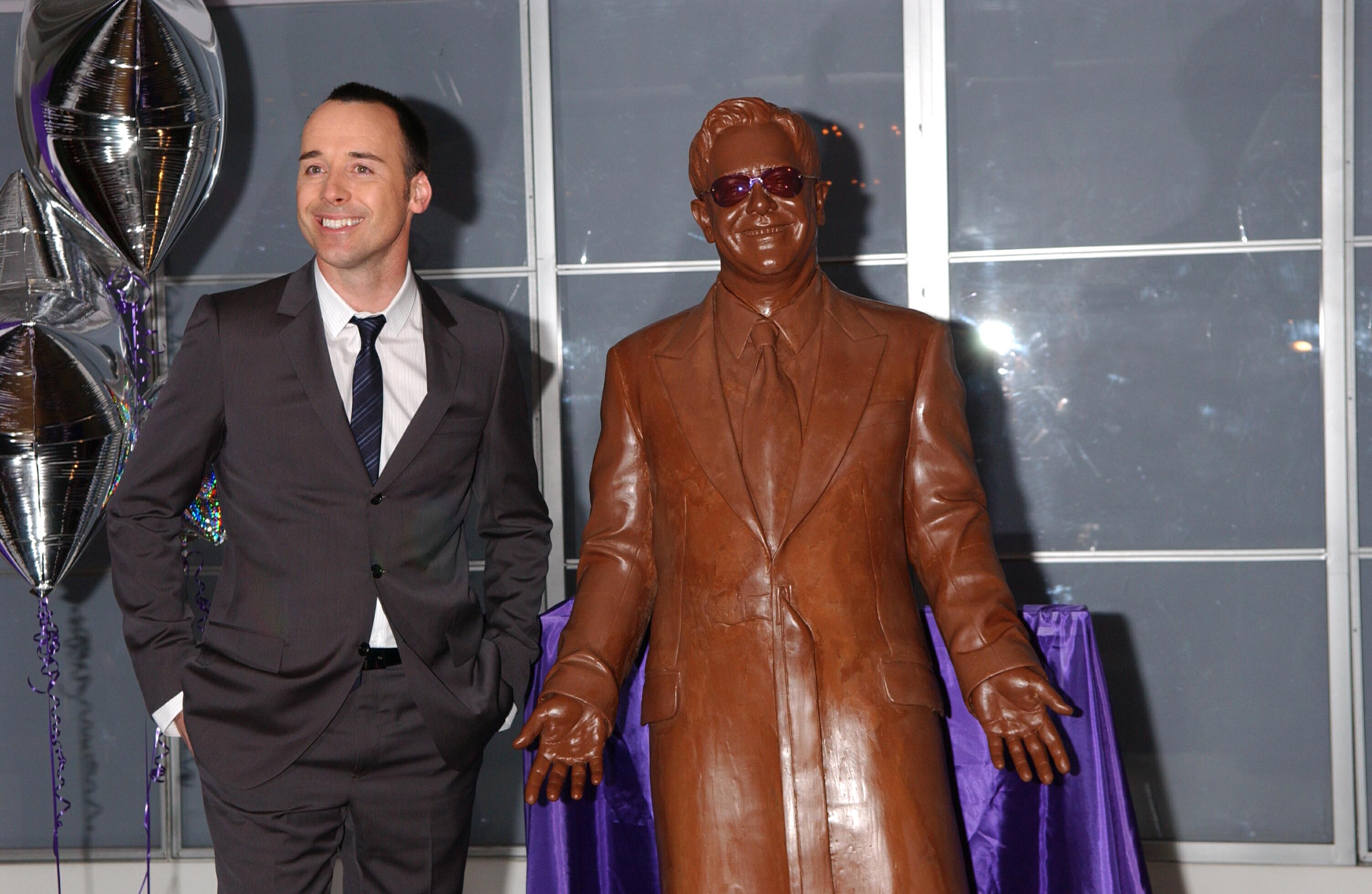 Elton John statue and David Furnish