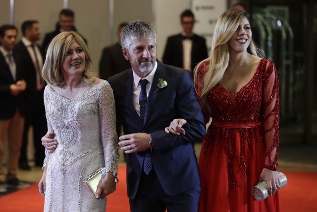 Lionel Messi's father Jorge, centre, with his mother and sister 