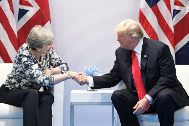 Theresa May talks to Donald Trump. (Stefan Rousseau/PA)