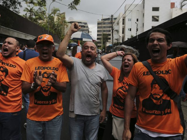 Supporters cheer for Leopoldo Lopez in Caracas (Fernando Llano/AP)