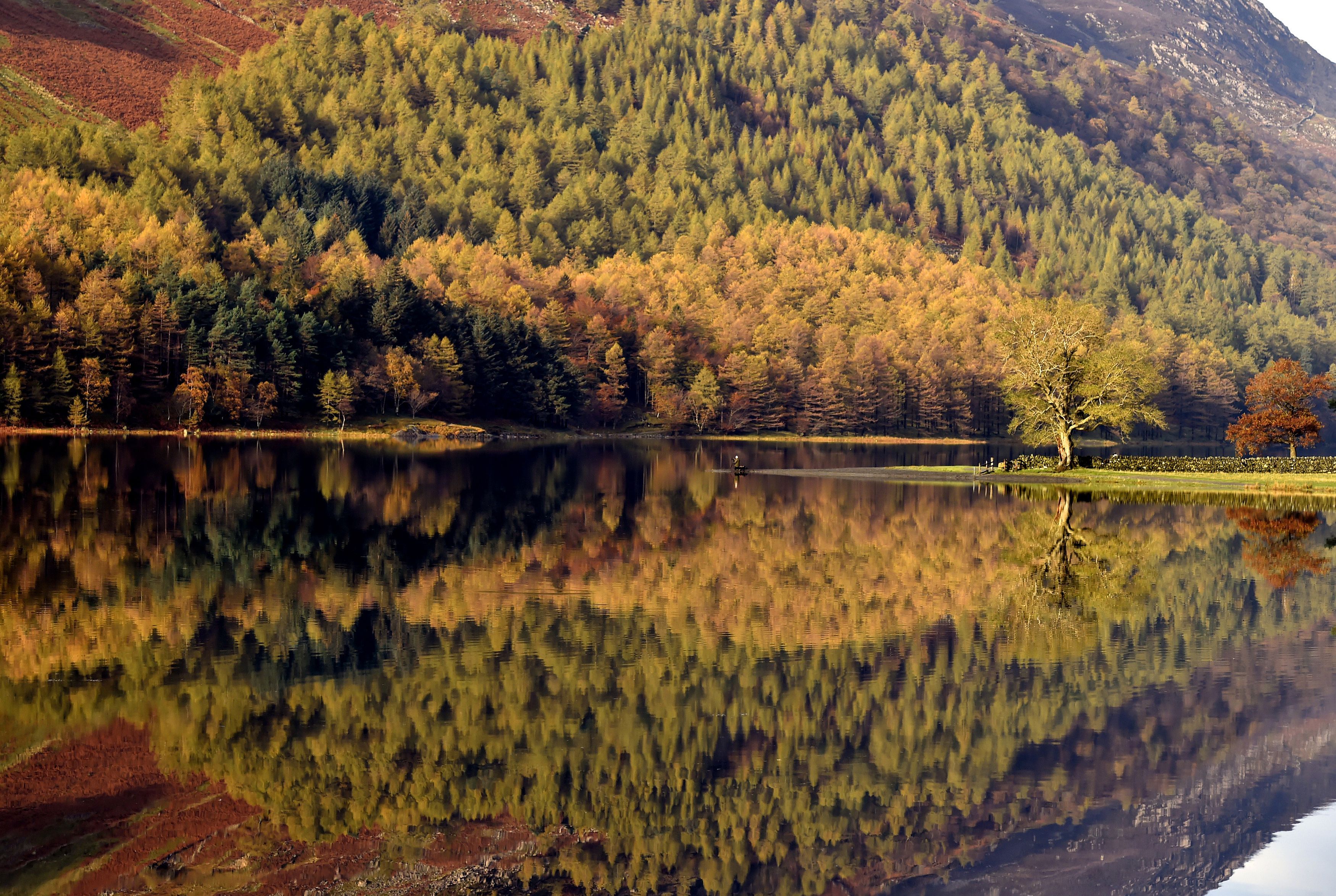 Autumn reflections are seen on Lake Buttermere