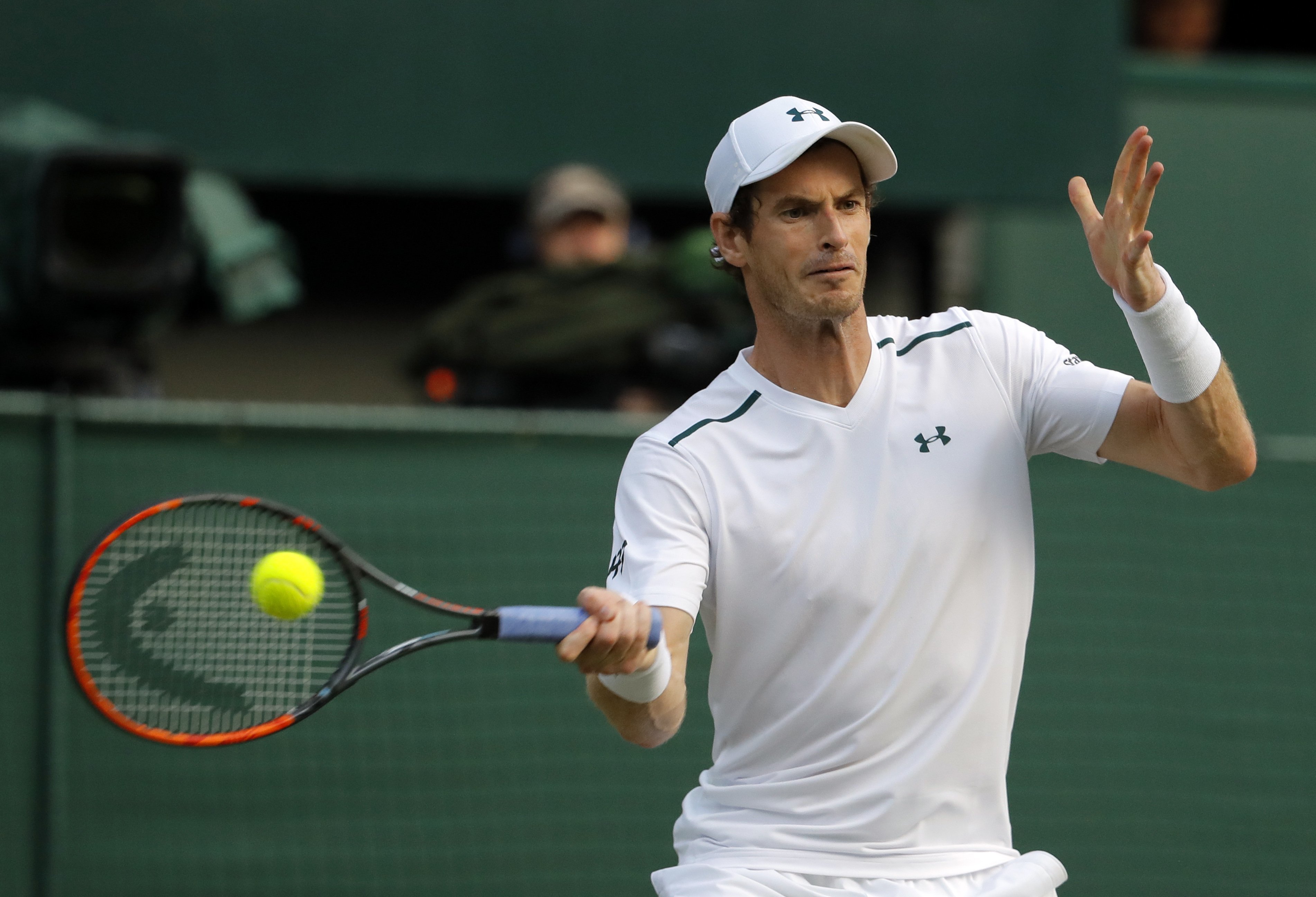 Britain's Andy Murray returns to Italy's Fabio Fognini during their Men's Singles Match on day five at the Wimbledon Tennis Championships in London Friday, July 7, 2017. (AP Photo/Alastair Grant)