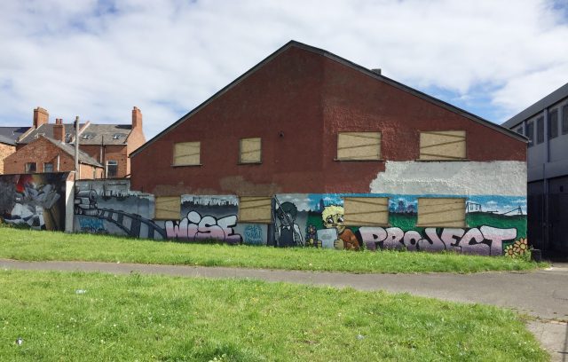 Properties being boarded up close to the Ravenscroft Avenue bonfire in east Belfast (David Young/PA)