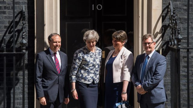 Members of the Democratic Unionist Party are welcomed to 10 Downing Street by Theresa May