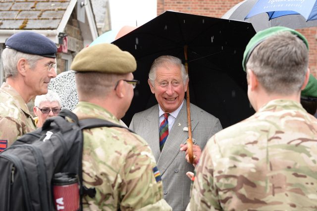 Charles jokes with troops during a visit to the Regimental Museum of the Royal Welsh (Ben Birchall/PA) 