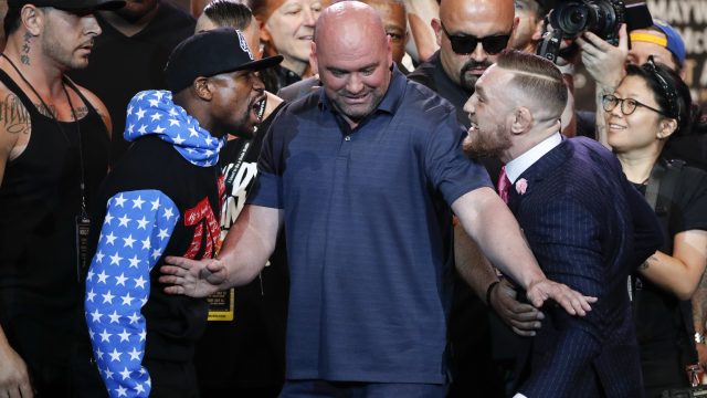 Floyd Mayweather and Conor McGregor taunt each other at their Los Angeles press conference