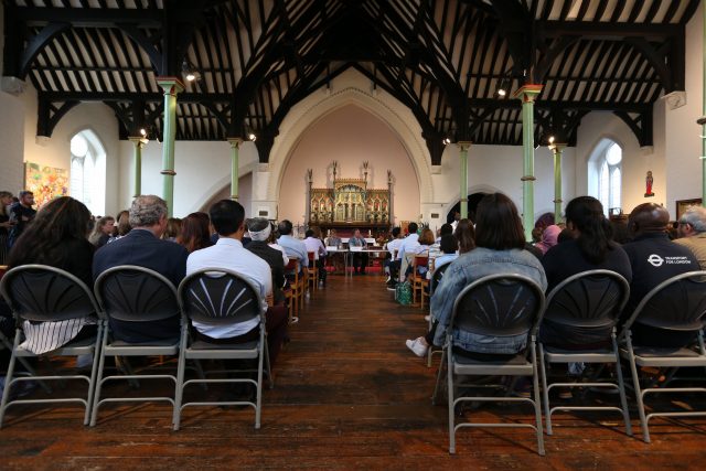 community attend a public meeting at St Clements Church 