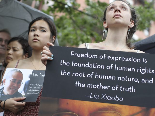 Supporters of Liu Xiaobo attend a vigil in New York (Mary Altaffer/AP)