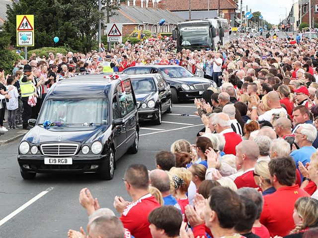 Thousands lined the streets (Owen Humphreys/PA)