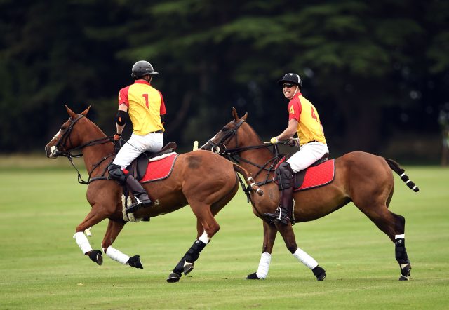 Prince Harry and The Duke of Cambridge (right) take part in the Jerudong Trophy charity polo match at Cirencester Park Polo Club. PRESS ASSOCIATION Photo. Picture date: Saturday July 15, 2017. Photo credit should read: Joe Giddens/PA Wire