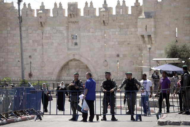 Israeli border police stand guard outside the Damascus Gate in Jerusalem's Old City