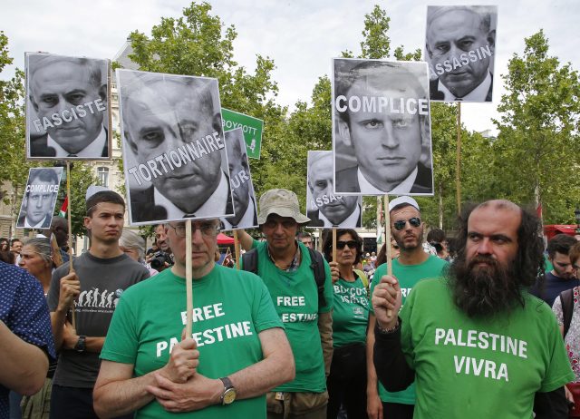 Pro-Palestinian activists in Paris. (Michel Euler/AP)