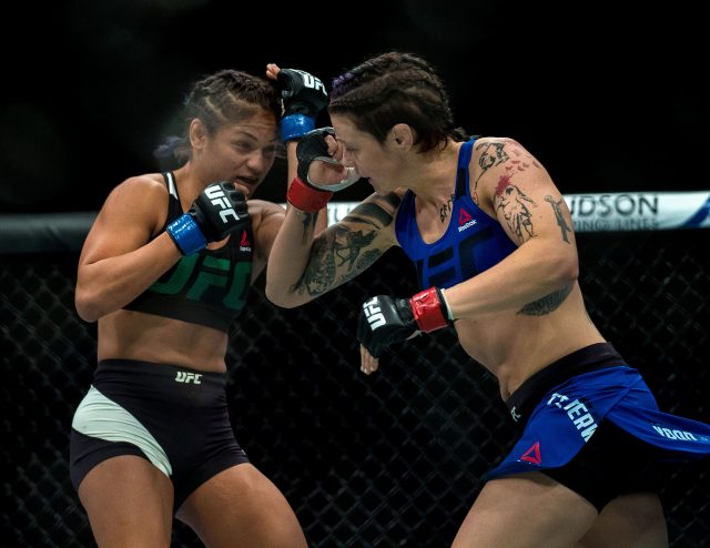 Joanne Calderwood (blue shorts) is defeated by Cynthia Calvillo