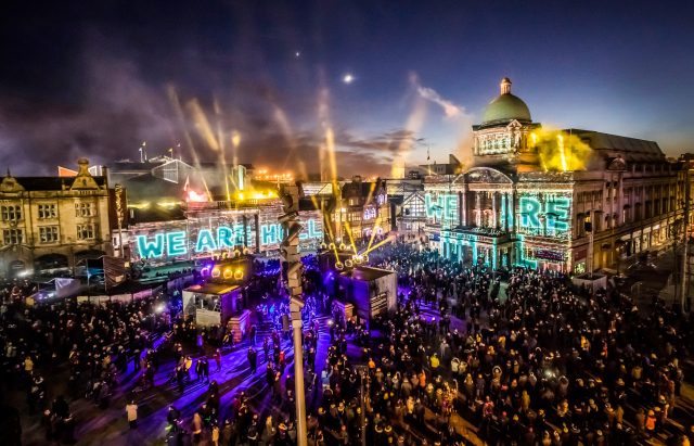 An installation titled We Are Hull is projected onto buildings in the city's Queen Victoria Square