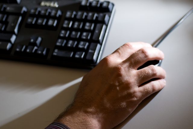 A man using a computer mouse
