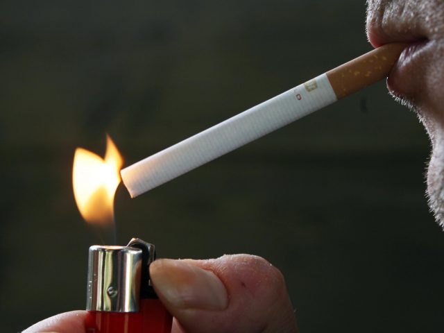 Picture of a man smoking a cigarette (Owen Humphreys/PA)