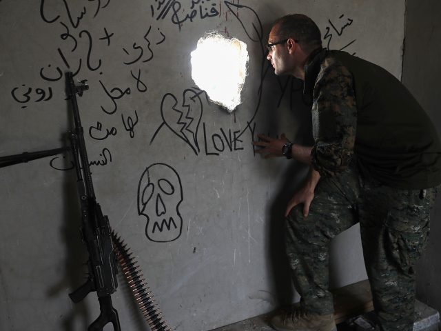 Macer Gifford looks onto an Islamic State controlled street in Raqqa (Hussein Malla/AP)