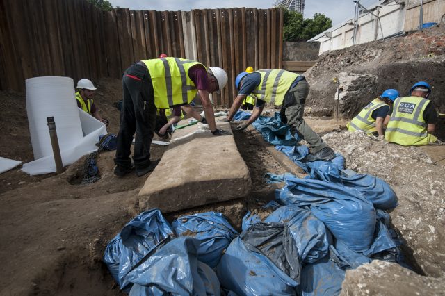 Archaeologists prepare to lift the lid at the site in Swan Street, Southwark (Lauren Hurley/PA)