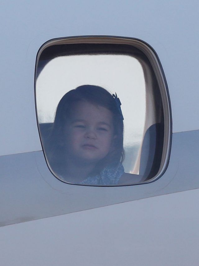 Princess Charlotte looks out of the plane window