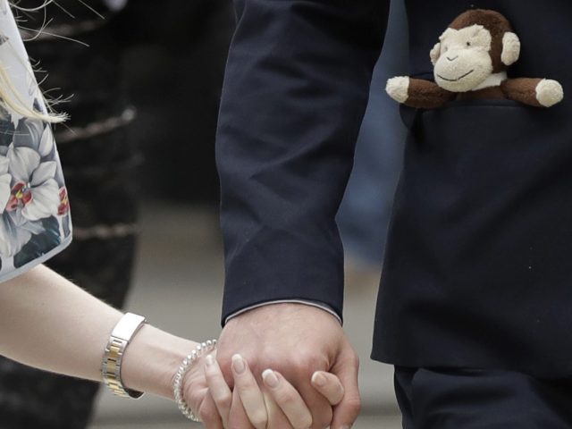 A toy monkey in the pocket of Charlie's father Chris Gard (Matt Dunham/AP/PA)