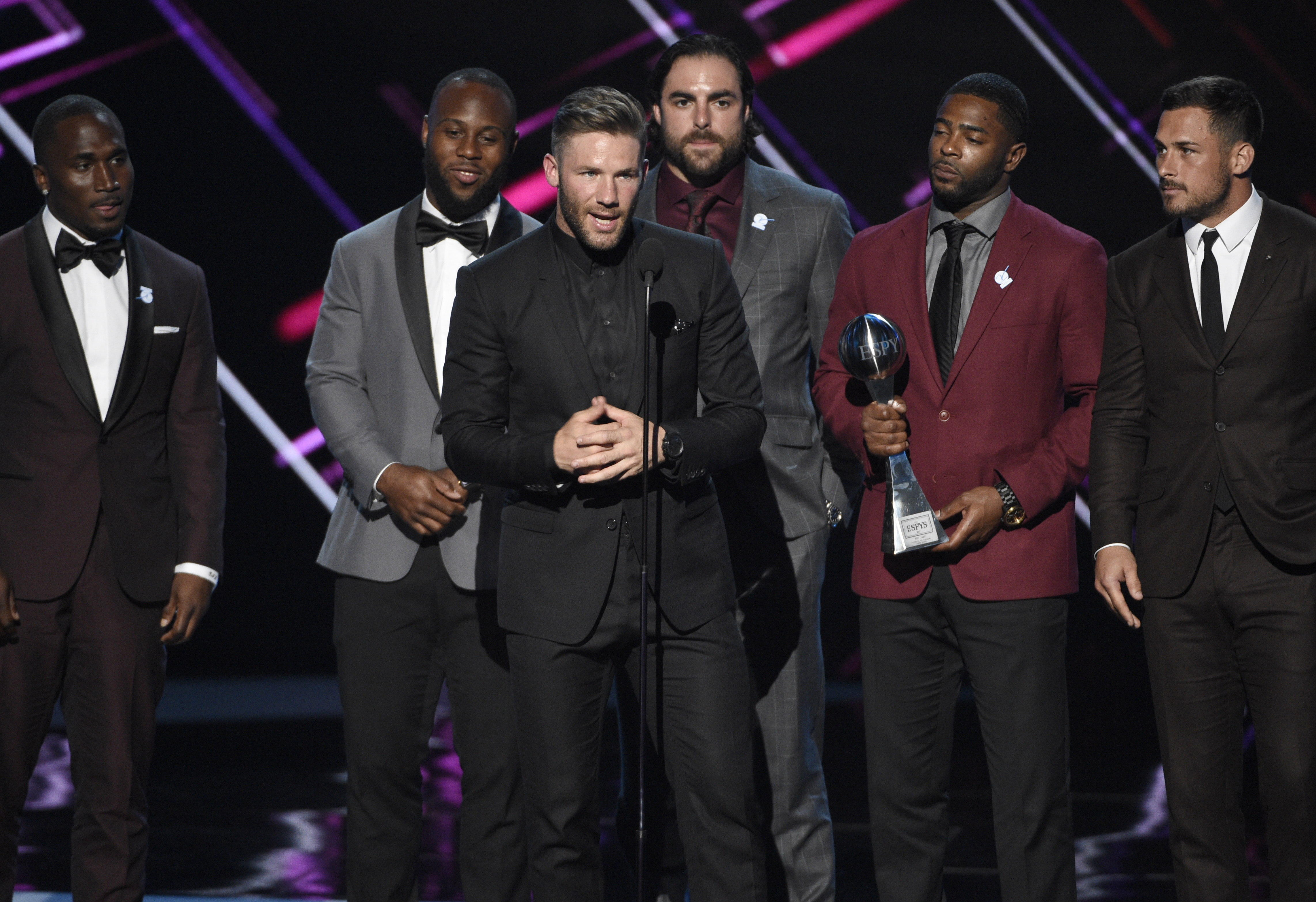 NFL football player Julian Edelman, of the New England Patriots, accepts the award for best game at Super Bowl LI at the ESPYS at the Microsoft Theater on Wednesday, July 12, 2017, in Los Angeles. Pictured from left, Dion Lewis, James White, Nate Ebner, Malcolm Butler and Danny Amendola. (Photo by Chris Pizzello/Invision/AP)