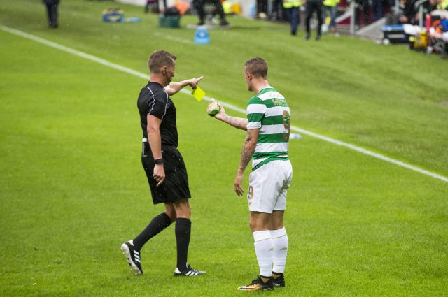 Leigh Griffiths speaks with referee Alejandro Jose Hernandez Hernandez after a glass bottle of Buckfast was thrown at him (Liam McBurney/PA)