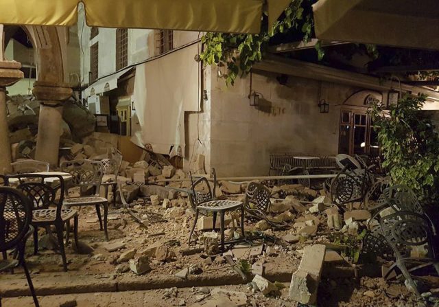 A cafe setting is littered with rubble following the earthquake