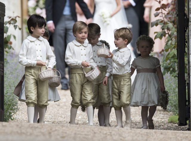 Prince George leaves with other page boys and flower girls following the wedding of Pippa Middleton and James Matthews