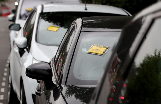 Several cars were left in restricted parking bays on a road near Gatwick Airport (Gareth Fuller/PA)