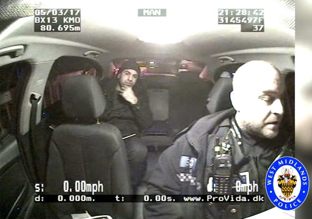 Handout screengrab of a police officer speaking to one of the suspects who raced at speeds of up to 134mph