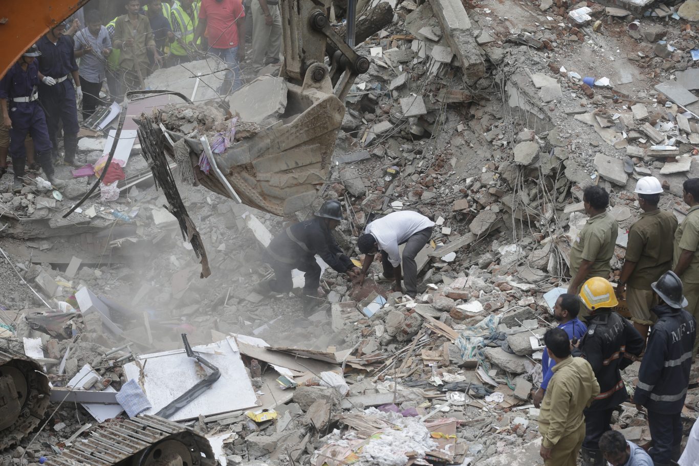 Six killed and dozens feared trapped in Mumbai building collapse ...