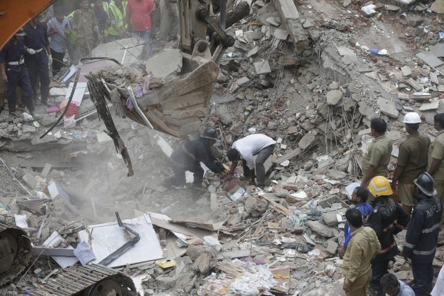 Rescuers work after a five-storey building collapsed in the Ghatkopar area of Mumbai