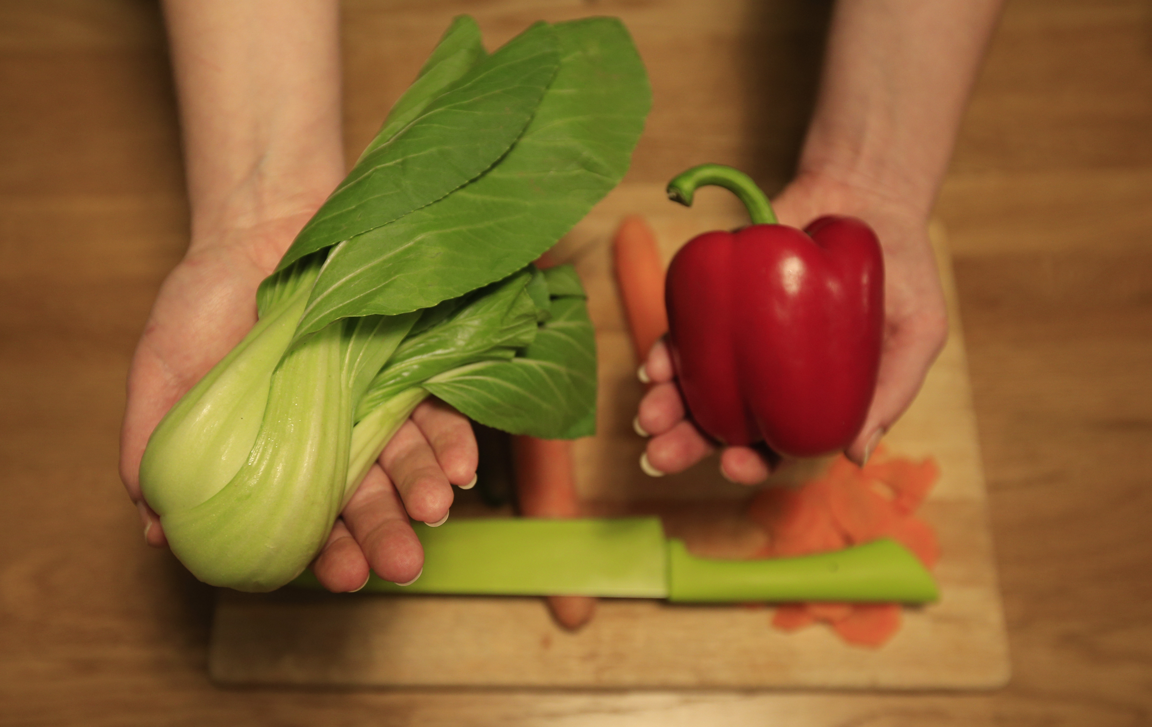 Raw vegetables on a chopping board (Jonathan Brady/PA)
