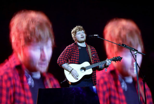 Ed Sheeran performing on the Pyramid stage at Glastonbury Festival, at Worthy Farm in Somerset.