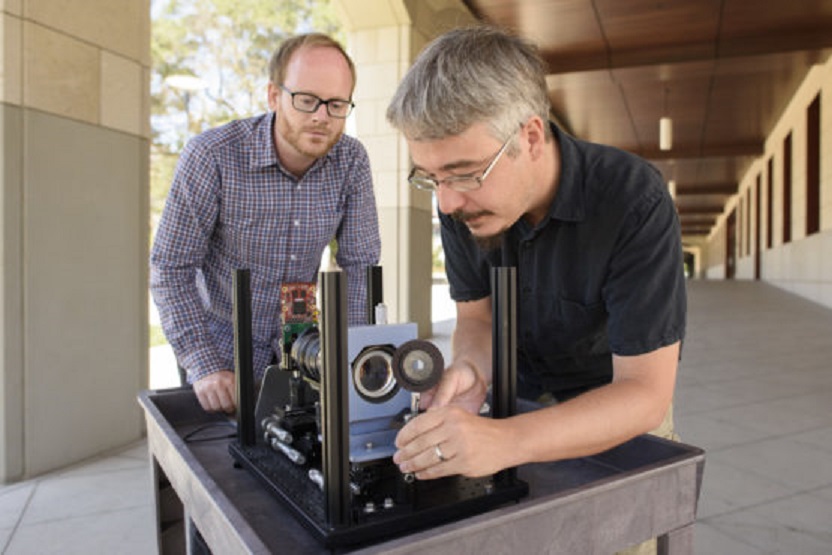 Assistant Professor Gordon Wetzstein, left, and postdoctoral research fellow Donald Dansereau with a prototype of the monocentric camera