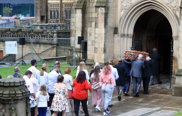 Mourners follow the coffin of Saffie Roussos, who died in the Manchester Arena bombing, as it arrives at Manchester Cathedral for her funeral service 
