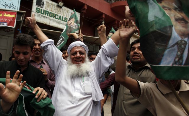 Opposition party supporters celebrate following the Supreme Court's announcement