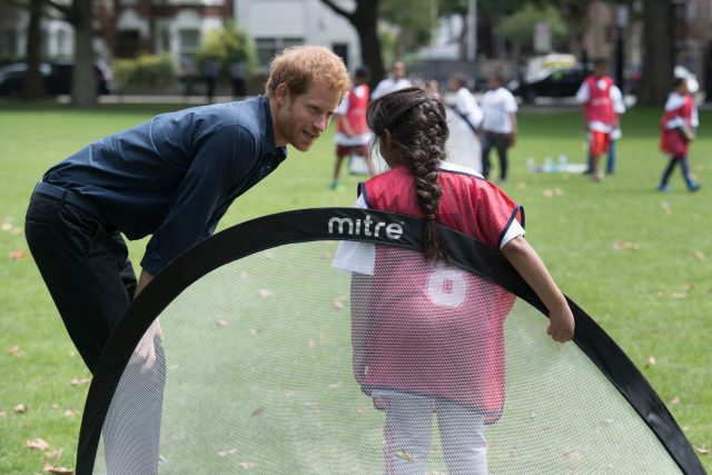 Prince Harry helped one of the children who was in goal (Stefan Rousseau/PA)