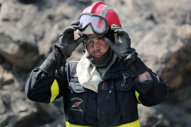A firefighter takes a break at the site of a wildfire near the village of Ortale, Corsica (Raphael Poletti/AP)