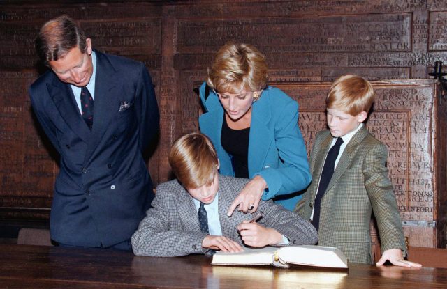Diana with Charles as Prince William signs the traditional Entrance Book at Eton in 1995 (PA)