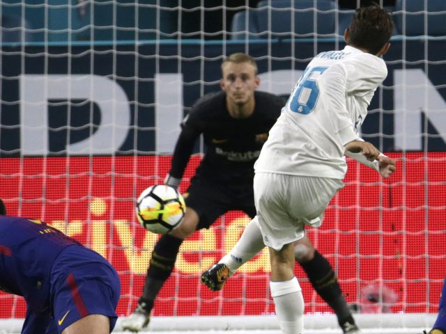 Real Madrid's Mateo Kovacic scores past Barcelona goalkeeper Jasper Cillessen