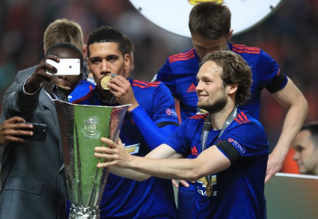 Daley Blind, right, holds the Europa League trophy